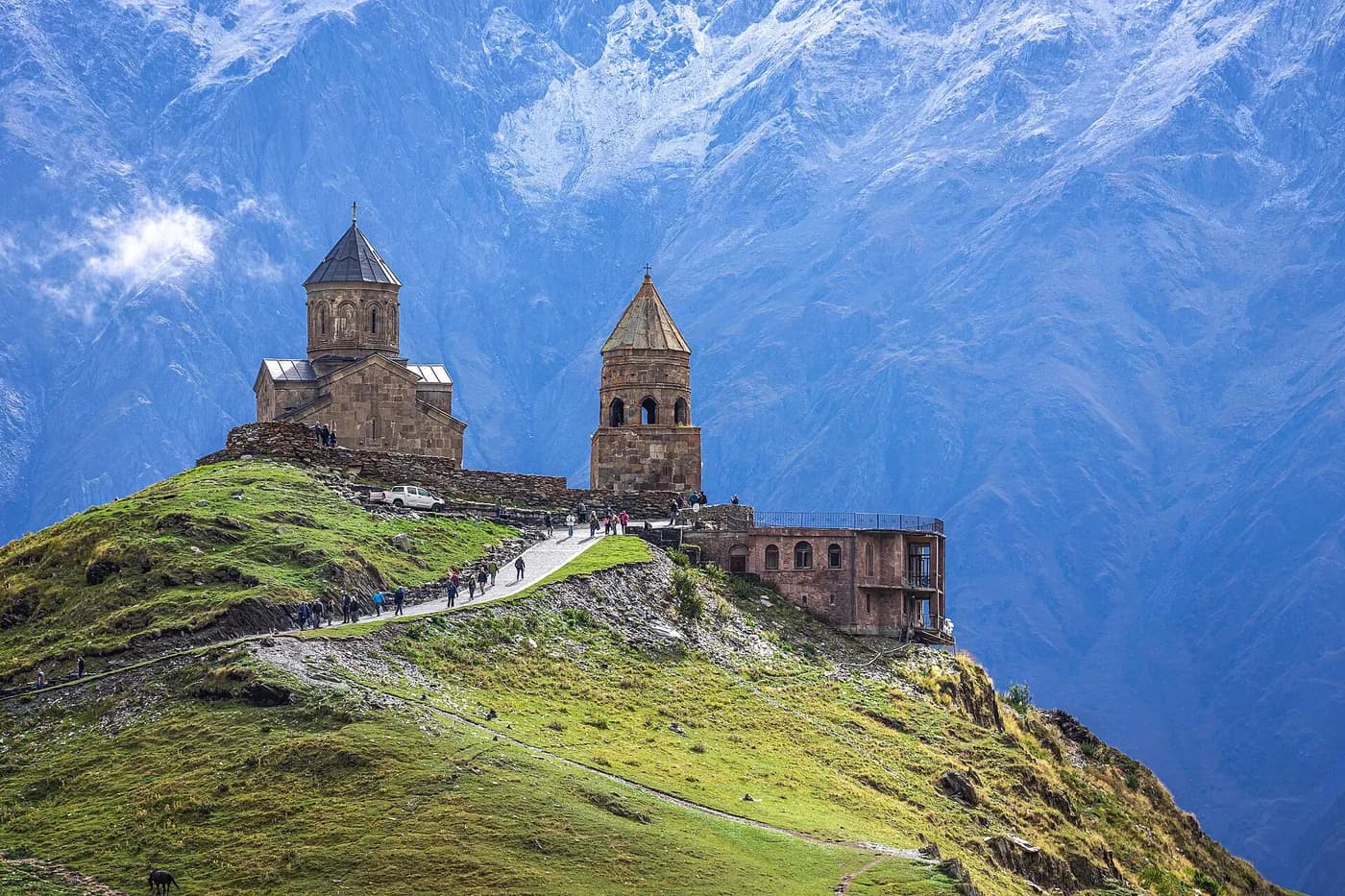 Church on a ridge below the Caucasus mountains